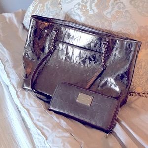Metallic silver Michael Kors purse with matching wallet.